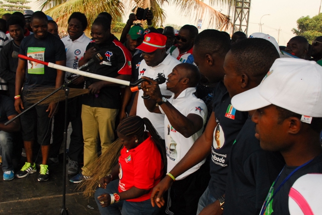 Akinwunmi Ambode and some physically challenged Lagosians during the 10,000 Man March event