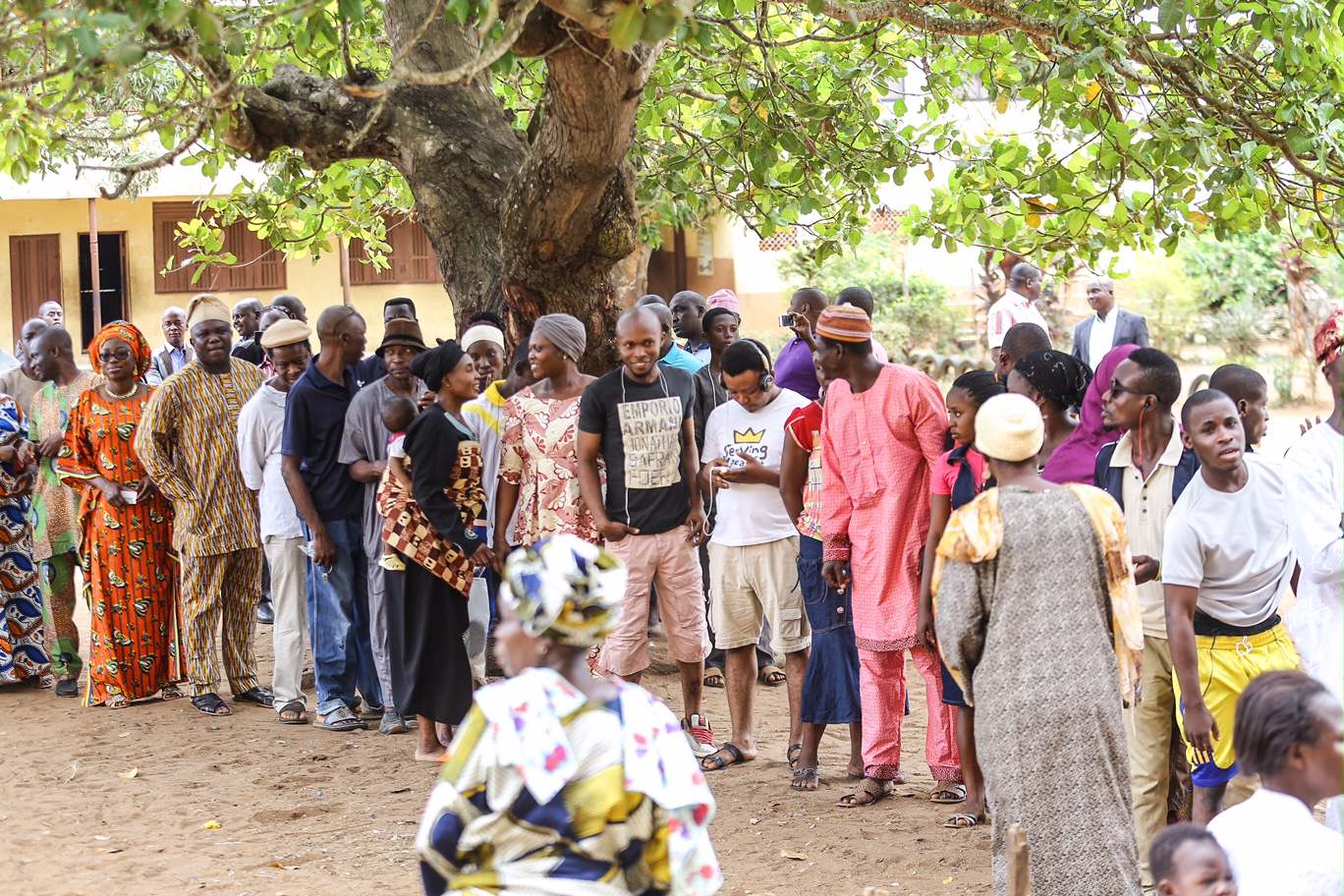 Akinwunmi Ambode and his wife, Bolanle Ambode on Queue at Ward A5 - Unit 33 Polling Centre in Ogunmodede Secondary school for Accreditation