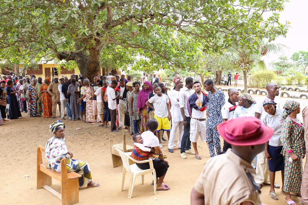 Akinwunmi Ambode and his wife, Bolanle Ambode on Queue at Ward A5 - Unit 33 Polling Centre in Ogunmodede Secondary school for Accreditation