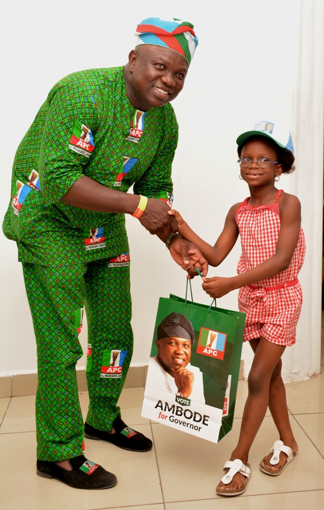 Akinwunmi Ambode having a warm handshake with Oladunmomi