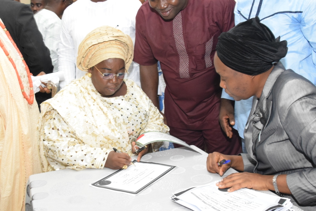 Dr. (Mrs.) Idiat Oluranti Adebule, Lagos State 2015 Deputy Governor-Elect, Signing the Certificate